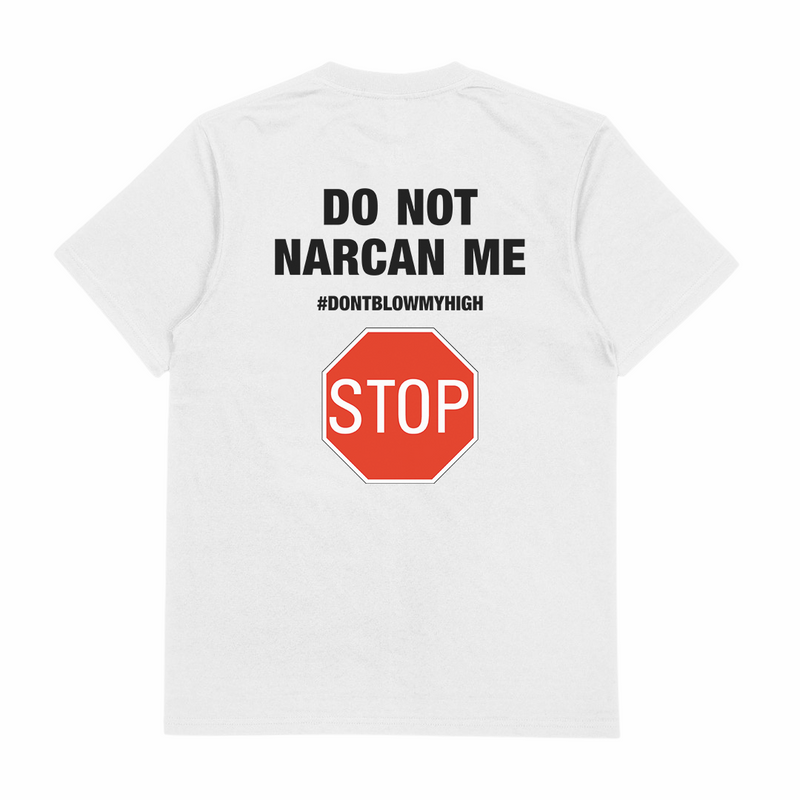 The Do Not Narcan Me T-Shirt (Backprint) is a white tee made from ethically grown cotton, with black "DO NOT NARCAN ME" and "#DONTBLOWMYHIGH" text on the front and a large red STOP sign graphic with "STOP" on the back.