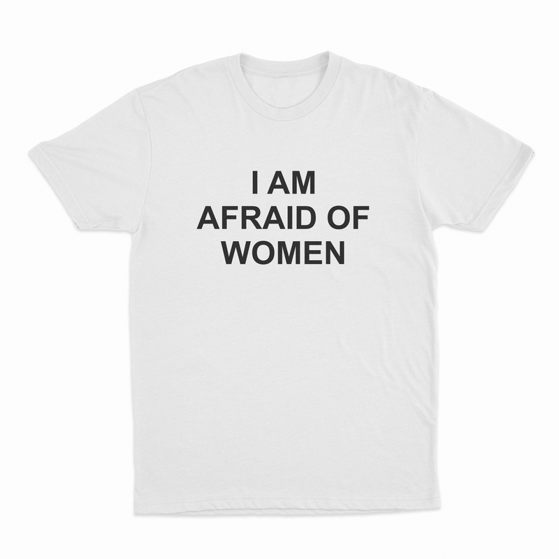 The I Am Afraid Of Women T-Shirt is a plain white tee with bold, black, uppercase text across the chest. Made from ethically grown cotton, it weighs 175 GSM for comfort and durability.