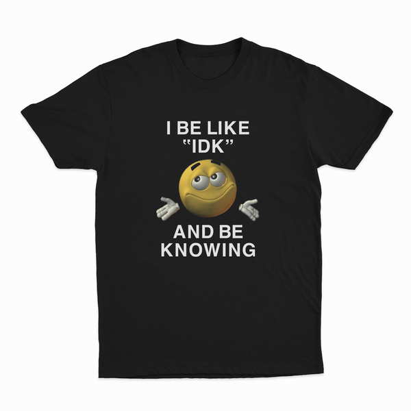 The I Be Like "IDK" And Be Knowing T-Shirt features a smiling shrugging emoji and bold text, making it an ideal conversation starter for anyone who loves funny shirts.