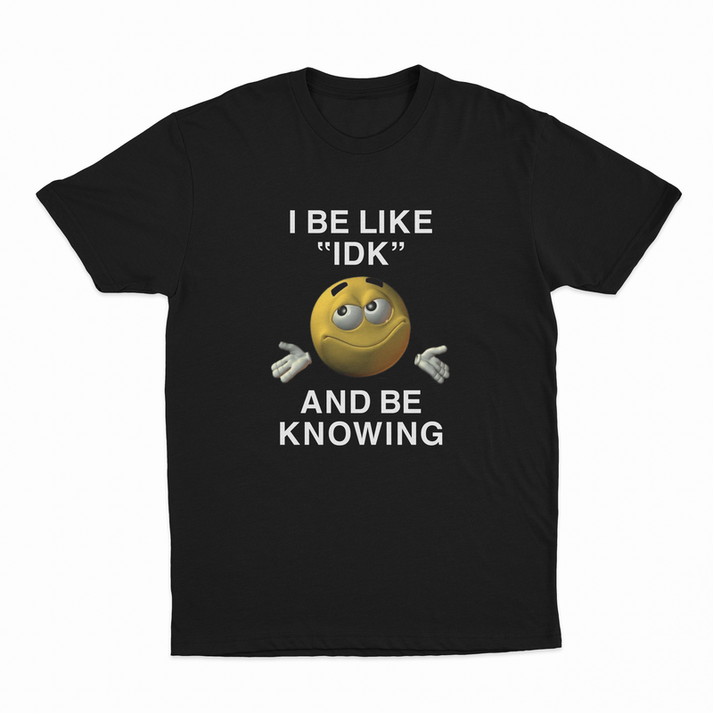 The I Be Like "IDK" And Be Knowing T-Shirt features a smiling shrugging emoji and bold text, making it an ideal conversation starter for anyone who loves funny shirts.