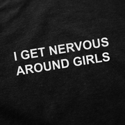 Close-up of the I Get Nervous Around Girls T-Shirt in black cotton with white text. Crafted ethically at 175 GSM for a soft feel.