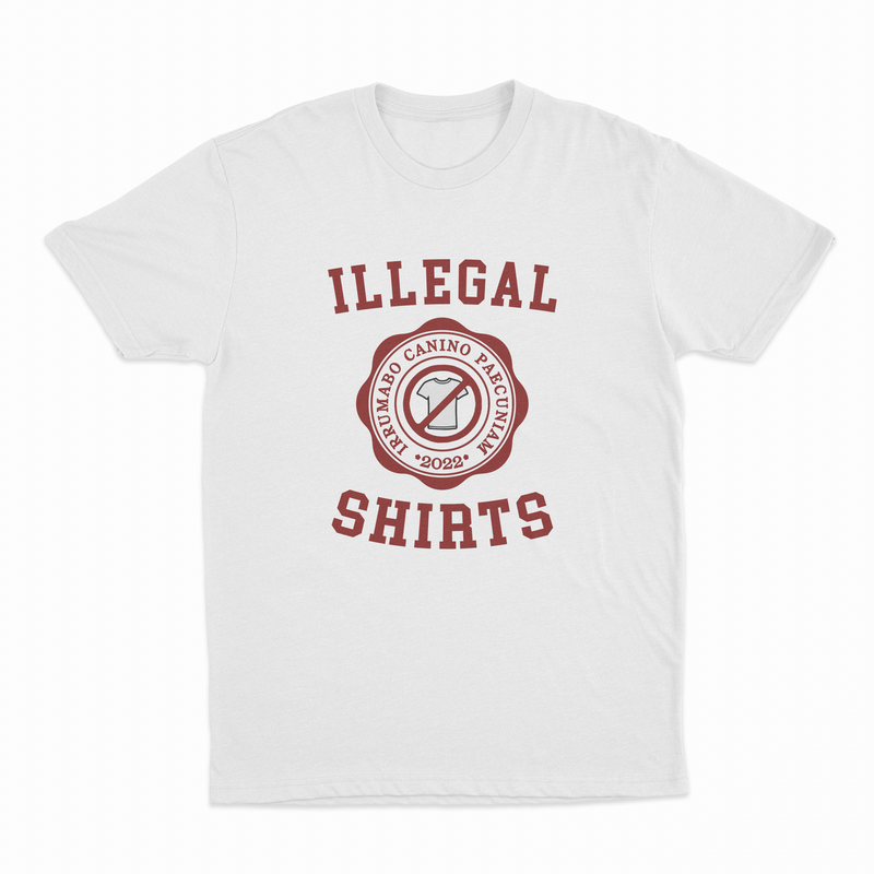 The Illegal Shirts Emblem T-Shirt features "ILLEGAL SHIRTS" in bold red, a round emblem with "ARMANDO CANINO PIEGQUINA 2022," and a shirt icon inside a red circle with a slash—ideal for fans of humorous tees.