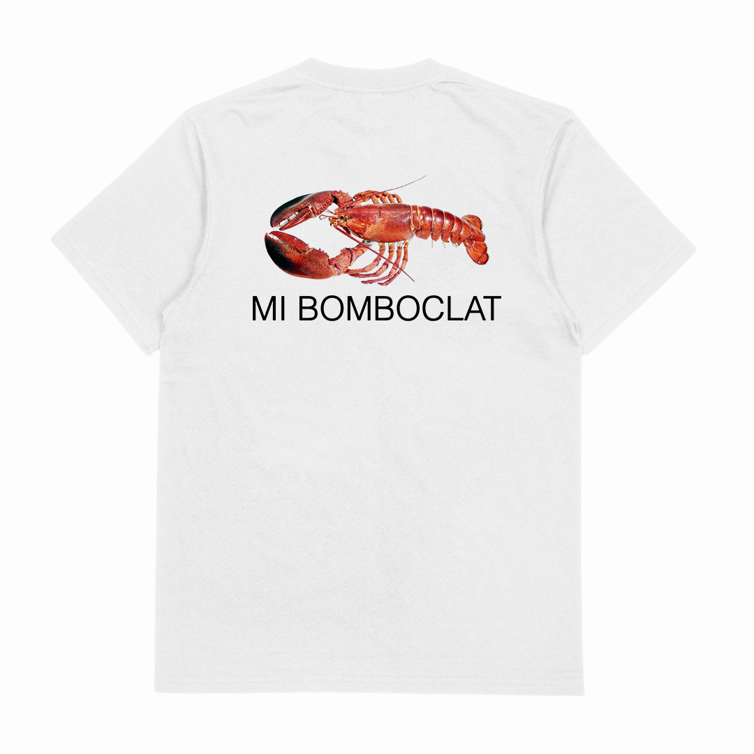 The Mi Bomboclat T-Shirt (Backprint) is a white tee made from ethically grown cotton, featuring a large red lobster graphic and bold black MI BOMBCLAT text on the back.