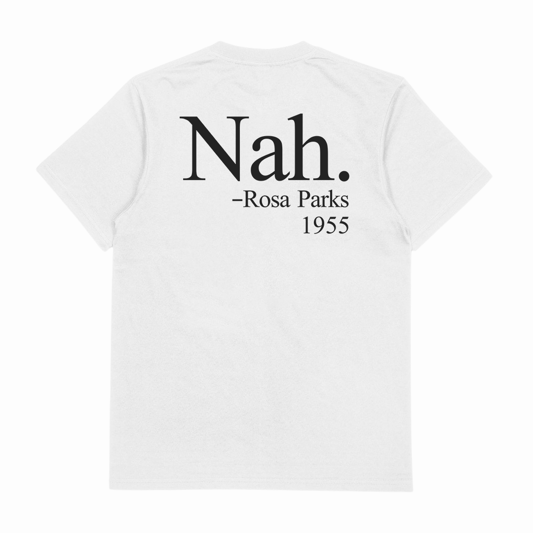The Nah. T-Shirt (Backprint) is a white cotton tee featuring bold black text on the back: Nah. — Rosa Parks 1955. Ethically made from responsibly grown materials.