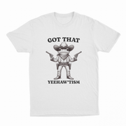 The Got That Yeehaw'Tism T-Shirt features a cartoon frog dressed as a cowboy with pistols and the hilarious text "GOT THAT YEEHAWTISM" above and below—perfect for adding humor to any collection.