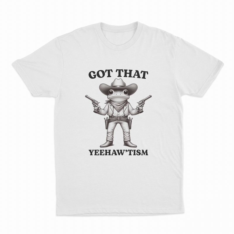 The Got That Yeehaw'Tism T-Shirt features a cartoon frog dressed as a cowboy with pistols and the hilarious text "GOT THAT YEEHAWTISM" above and below—perfect for adding humor to any collection.