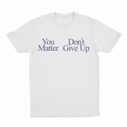 White T-shirt with “You Matter Don't Give Up” in black serif font—part of our funny shirts collection. Offers a positive spin compared to the You Don't Matter Give Up T-Shirt.