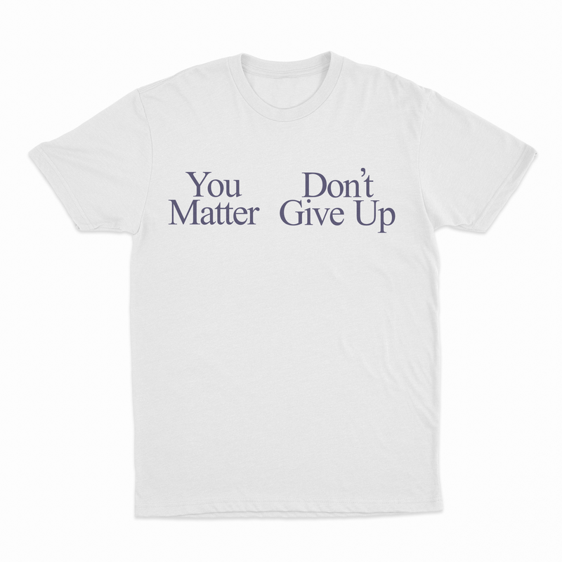 White T-shirt with “You Matter Don't Give Up” in black serif font—part of our funny shirts collection. Offers a positive spin compared to the You Don't Matter Give Up T-Shirt.