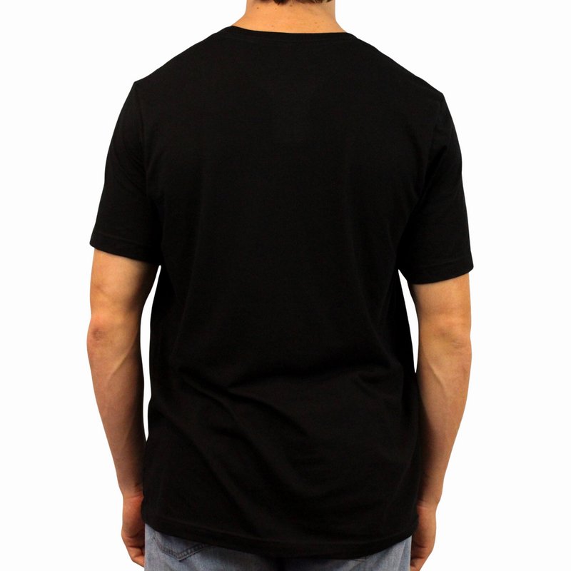 Wearing the I Heart Latinas T-Shirt, a person stands with their back to the camera in light blue jeans against a white background.
