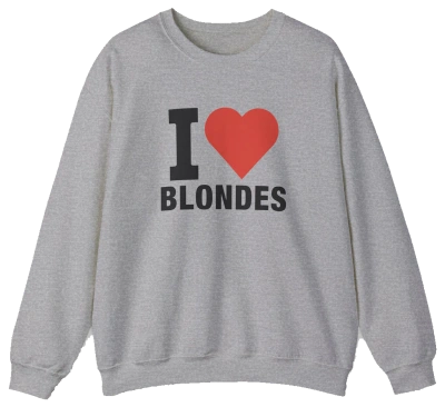 The I Heart Blondes Crewneck is a gray cotton-polyester sweatshirt with bold black lettering and a red heart on the front. Part of the Illegal Shirts collection, it's an eye-catching piece for anyone who loves standout style.