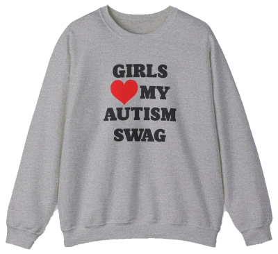 The Girls Heart My Autism Swag Crewneck is a gray sweatshirt featuring bold black letters and a red heart, perfect for anyone who loves making a fun, confident statement.