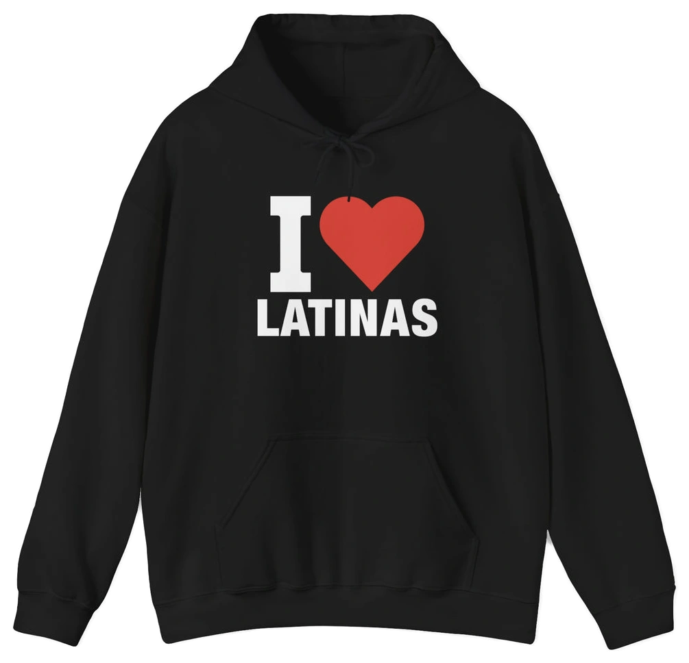 The I Heart Latinas Hoodie features bold white text with a large red heart on a black hoodie, made from medium-heavy fabric for comfort and warmth. Part of the exclusive Illegal Shirts collection.