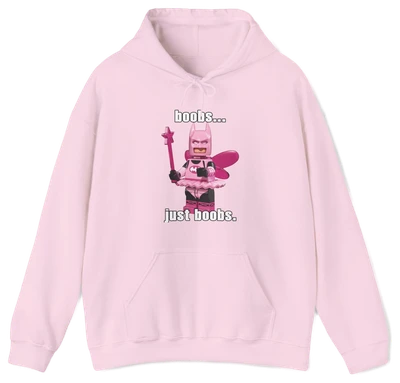 The Boobs... Just Boobs. Hoodie features a light pink LEGO-inspired armored figure with bold chest details and the phrase "boobs... just boobs" above and below. This cotton-polyester sweatshirt is an iconic Illegal Shirts design.
