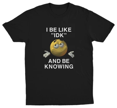 The I Be Like "IDK" And Be Knowing T-Shirt features a smiling shrugging emoji and bold text, making it an ideal conversation starter for anyone who loves funny shirts.