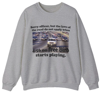 The O.J. Simpson Free Bird Crewneck features a gray design with cars on a highway and the caption: Sorry officer, but the laws of the road do not apply when 4:56 on Free Bird starts playing—ideal for fans of humor and classic rock.