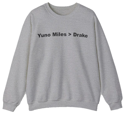 The Yuno Miles > Drake Crewneck is a gray sweatshirt featuring "Yuno Miles > Drake" in bold black text—a perfect pick for fans of funny shirts and the iconic crewneck style.