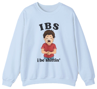 The IBS I Be Shittin' Crewneck is a light blue shirt featuring a cartoon boy clutching his stomach and crying, with "IBS" above and "i be shittin’" below—a humorous statement piece for those with a bold sense of humor.