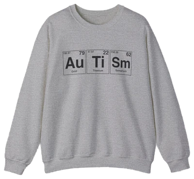 The Autism Periodic Table Crewneck by Illegal Shirts is a gray sweatshirt made from medium-heavy fabric, featuring "Autism" spelled with Au (gold), Ti (titanium), and Sm (samarium) symbols, including atomic numbers and weights.