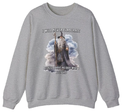 The "I Will Never Elaborate Crewneck" is a gray, medium-heavy sweatshirt featuring a wizard illustration and bold phrase. Part of Illegal Shirts, it’s perfect for anyone who loves humor and mystery in their style.