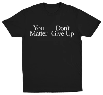 The You Don't Matter Give Up T-Shirt is a black tee with bold white serif text—ideal for fans of Illegal Shirts and statement designs.