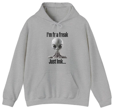 The "I'm FR A Freak Just LMK... Hoodie" by Illegal Shirts is a gray hoodie featuring a wide-eyed alien graphic and bold black lettering on medium-heavy fabric for lasting comfort and style.