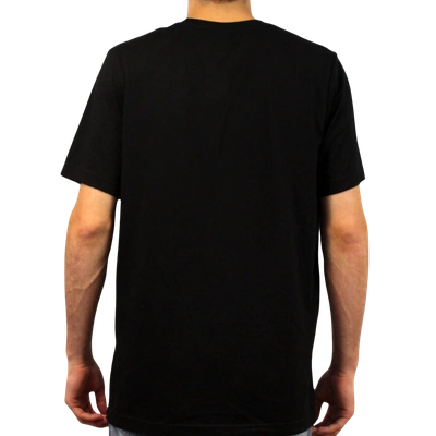 A person stands with their back to the camera, wearing a plain black Do Not Narcan Me T-Shirt and light blue jeans against a white background.