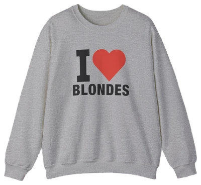 The I Heart Blondes Crewneck is a gray cotton-polyester sweatshirt with bold black lettering and a red heart on the front. Part of the Illegal Shirts collection, it's an eye-catching piece for anyone who loves standout style.