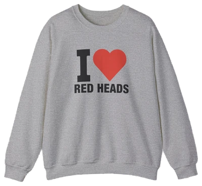 The I Heart Red Heads Crewneck is a gray cotton-polyester sweatshirt with long sleeves, a crew neck, and "I Heart Red Heads" with a red heart on the front. Part of the playful Illegal Shirts collection.