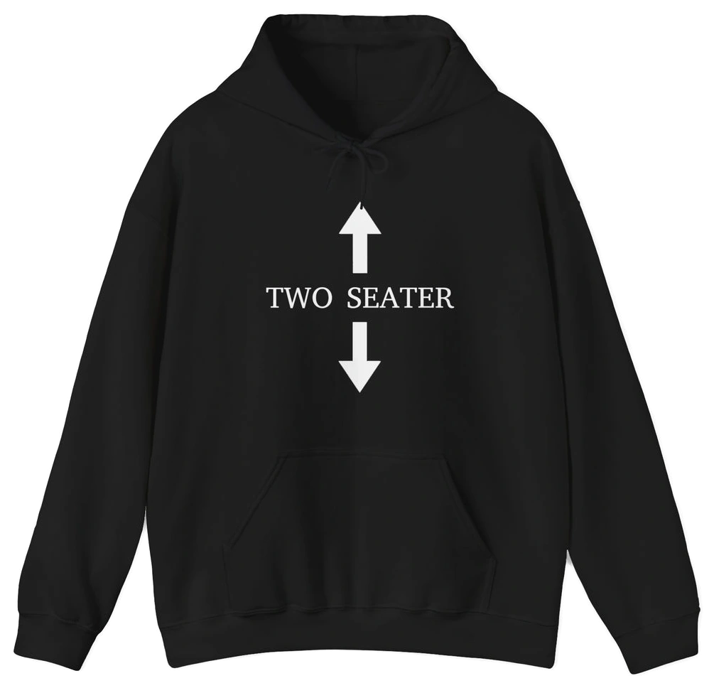 The Two Seater Hoodie from Illegal Shirts is black, with "TWO SEATER" in bold white text between arrows, made from medium-heavy fabric for comfort and style.