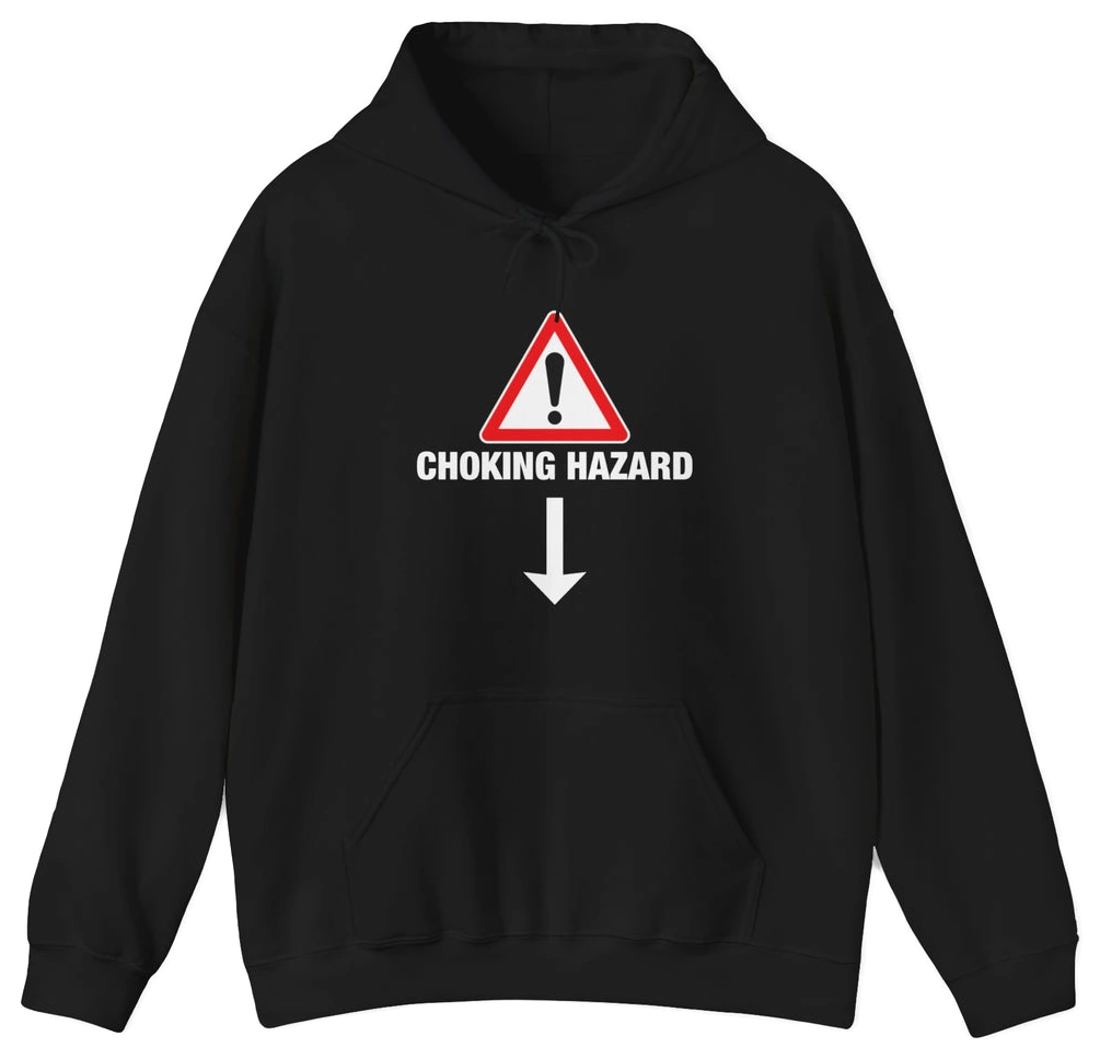 The Choking Hazard Hoodie by Illegal Shirts is black, made from medium-heavy fabric, and features a front warning sign with an exclamation mark above “CHOKING HAZARD” and a downward-pointing arrow.