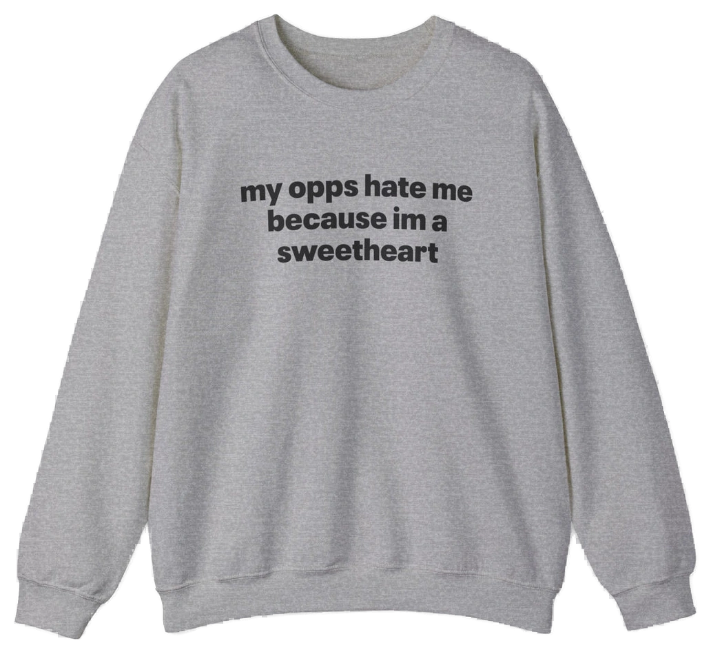 The My Opps Hate Me Because I'm A Sweetheart Crewneck is a light gray sweatshirt with bold black text—ideal for anyone who loves funny statement shirts.