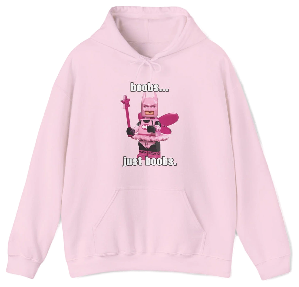 The Boobs... Just Boobs. Hoodie features a light pink LEGO-inspired armored figure with bold chest details and the phrase "boobs... just boobs" above and below. This cotton-polyester sweatshirt is an iconic Illegal Shirts design.
