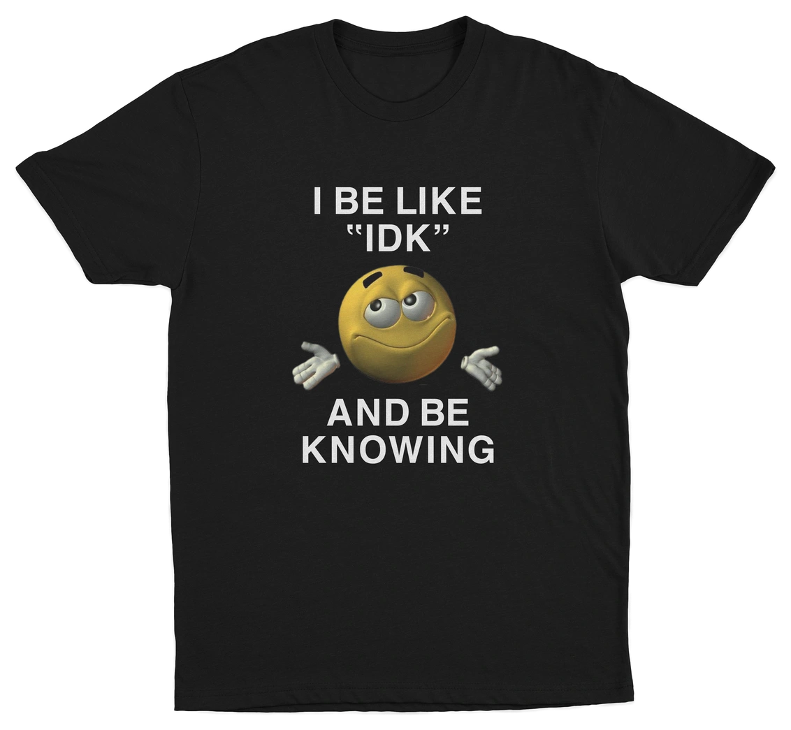 The I Be Like "IDK" And Be Knowing T-Shirt features a smiling shrugging emoji and bold text, making it an ideal conversation starter for anyone who loves funny shirts.