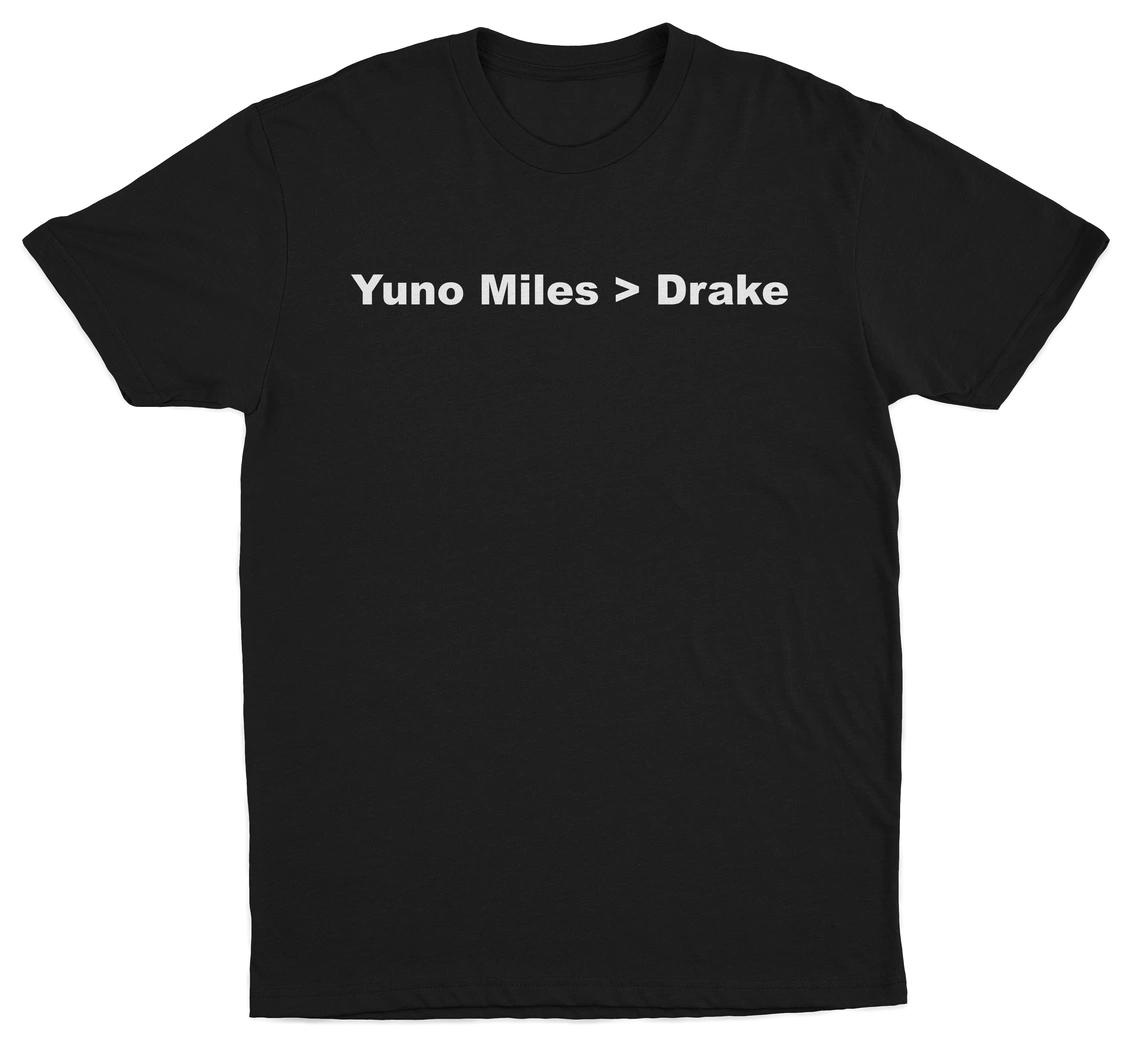 The Yuno Miles > Drake T-Shirt is a black tee with bold white "Yuno Miles > Drake" text across the chest—ideal for fans who love funny, playful shirts.
