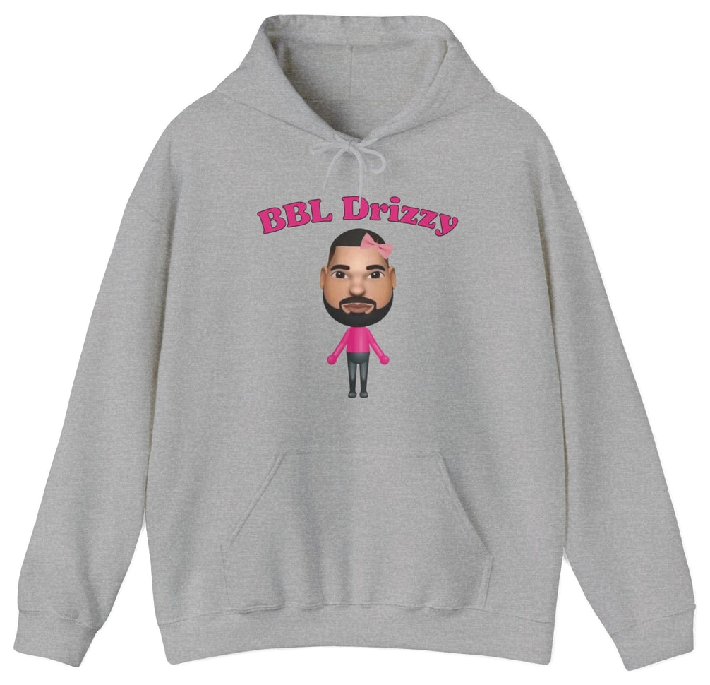 The BBL Drizzy Hoodie is a gray cotton-poly hoodie featuring “BBL Drizzy” in pink and a cartoon bearded character with a heart-shaped bandage, part of the distinctive Illegal Shirts collection.