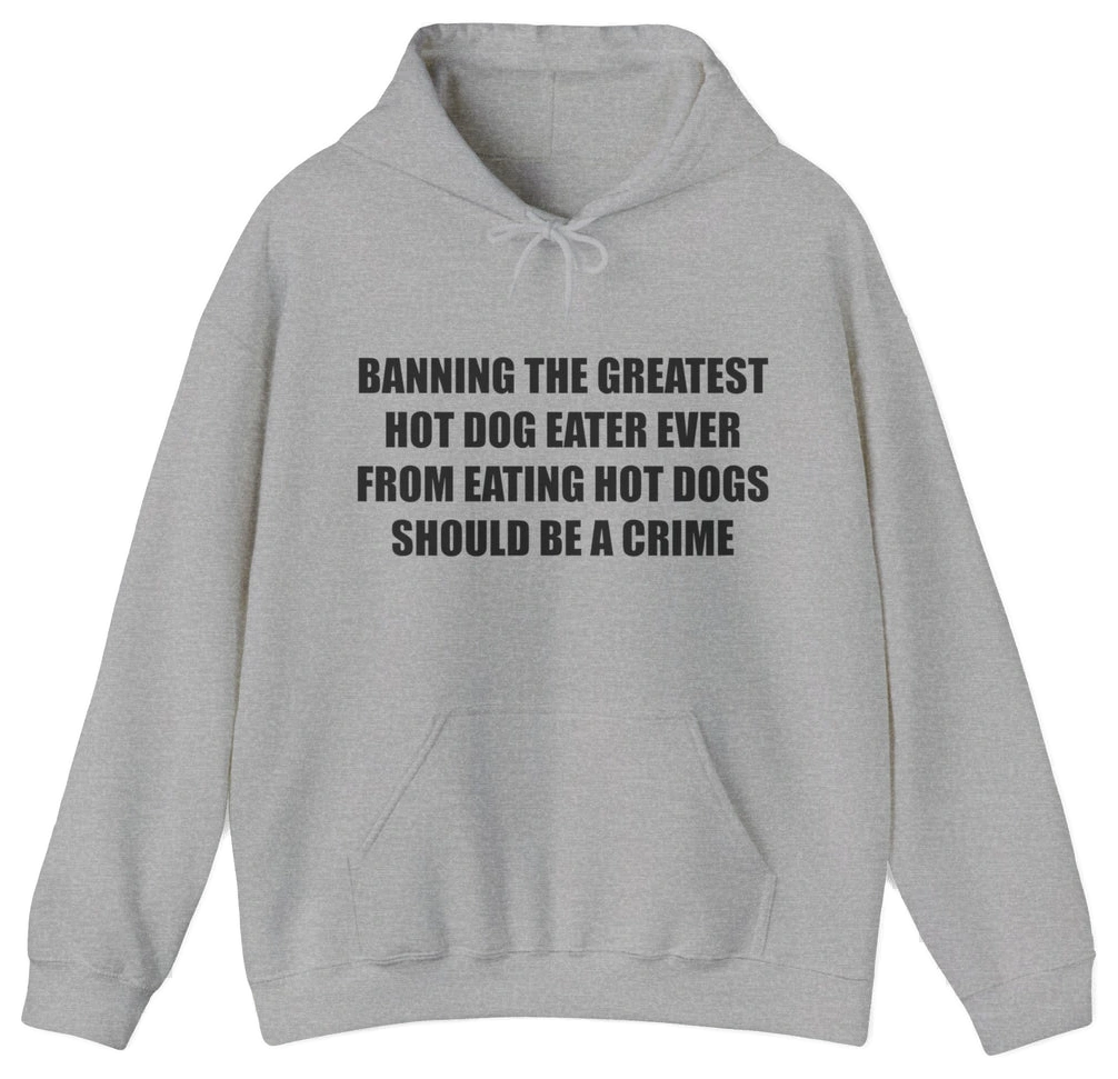 The “Banning The Greatest Hot Dog Eater Ever From Eating Hot Dogs Should Be A Crime Hoodie” features black text on gray—perfect for fans of funny hot dog shirts or anyone who loves humorous, bold statement apparel.