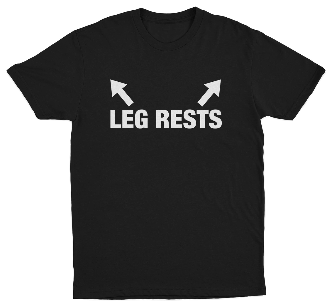 A black "The Ladies Man 3–Pack" T-shirt features white "LEG RESTS" text and two upward-pointing arrows above the words, printed on the front.